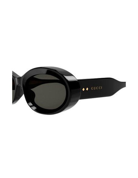 Runde schwarze Gucci-Sonnenbrille mit goldenen Akzenten: zeitlose Eleganz und Luxus